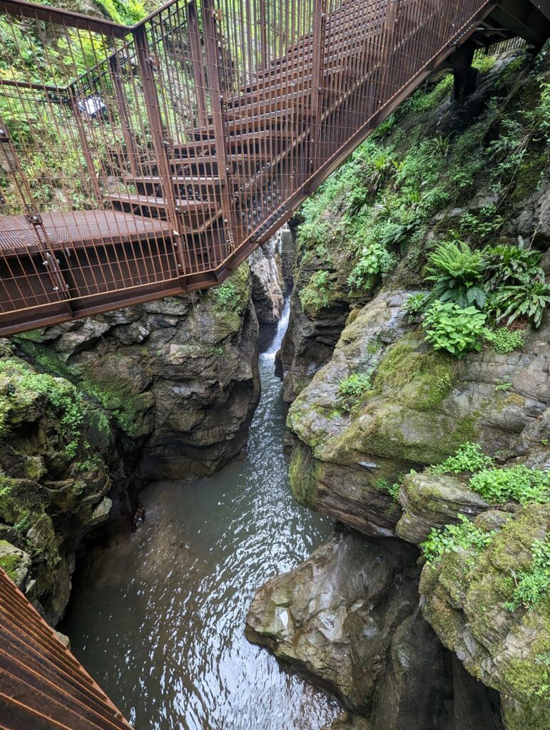 Metal steps above a small waterfall