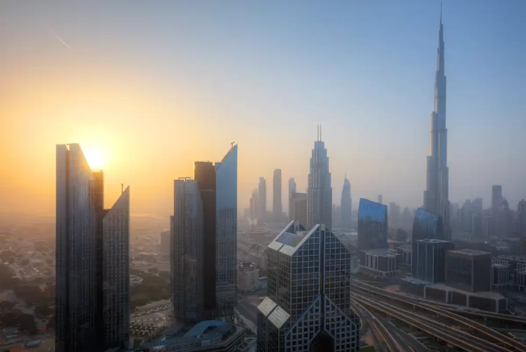 Sunrise in Dubai, with the Burj Khalifa on the right hand side of the image. Visiting the Burj Khalifa viewing deck at sunrise is a wonderful experience in Dubai.