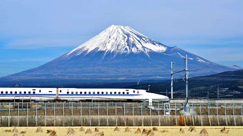 A Shinkansen passing Mount Fuji