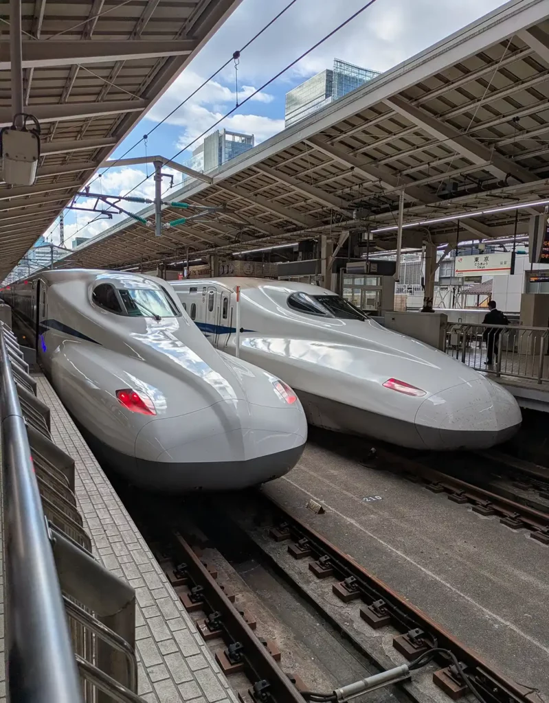 Two bullet trains waiting to depart from Tokyo Station