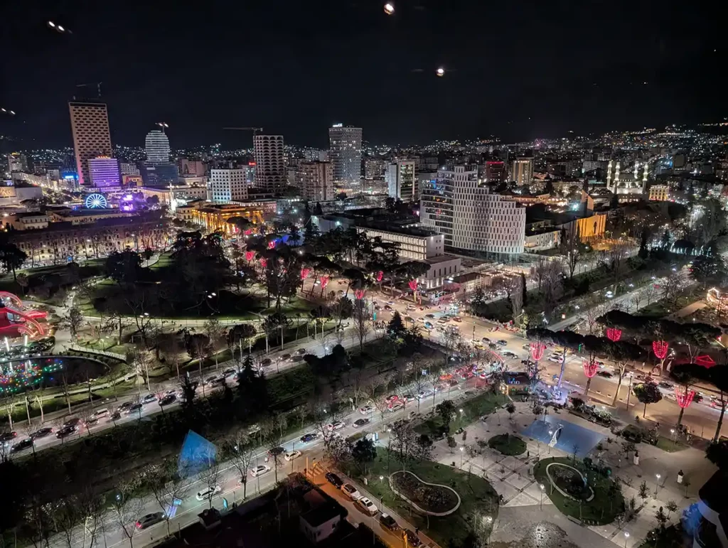 An arial night time view of Tirana