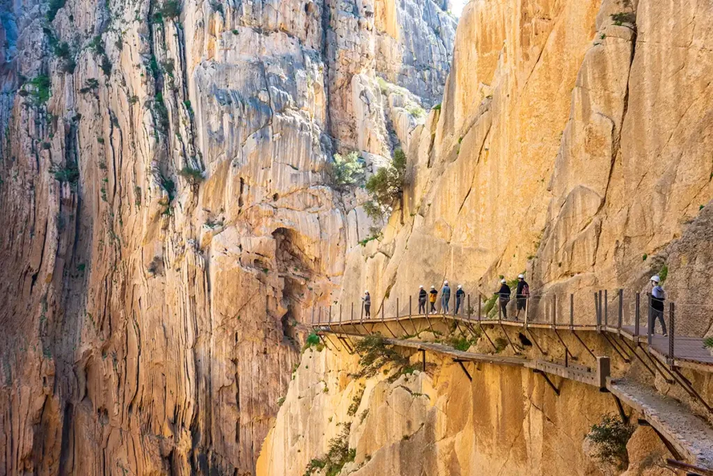 One of the walkways on the Caminito del Rey, suspended on a sheer rock face. The old path is visible just below.
