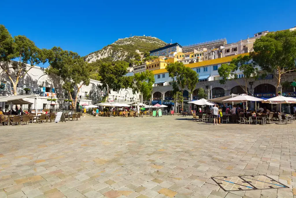 A large open square with restaurants around the edges