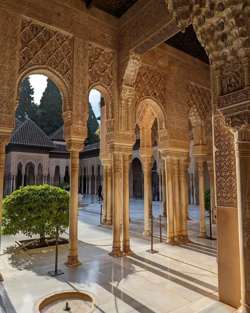Intricate, delicate stone arches around a central courtyard