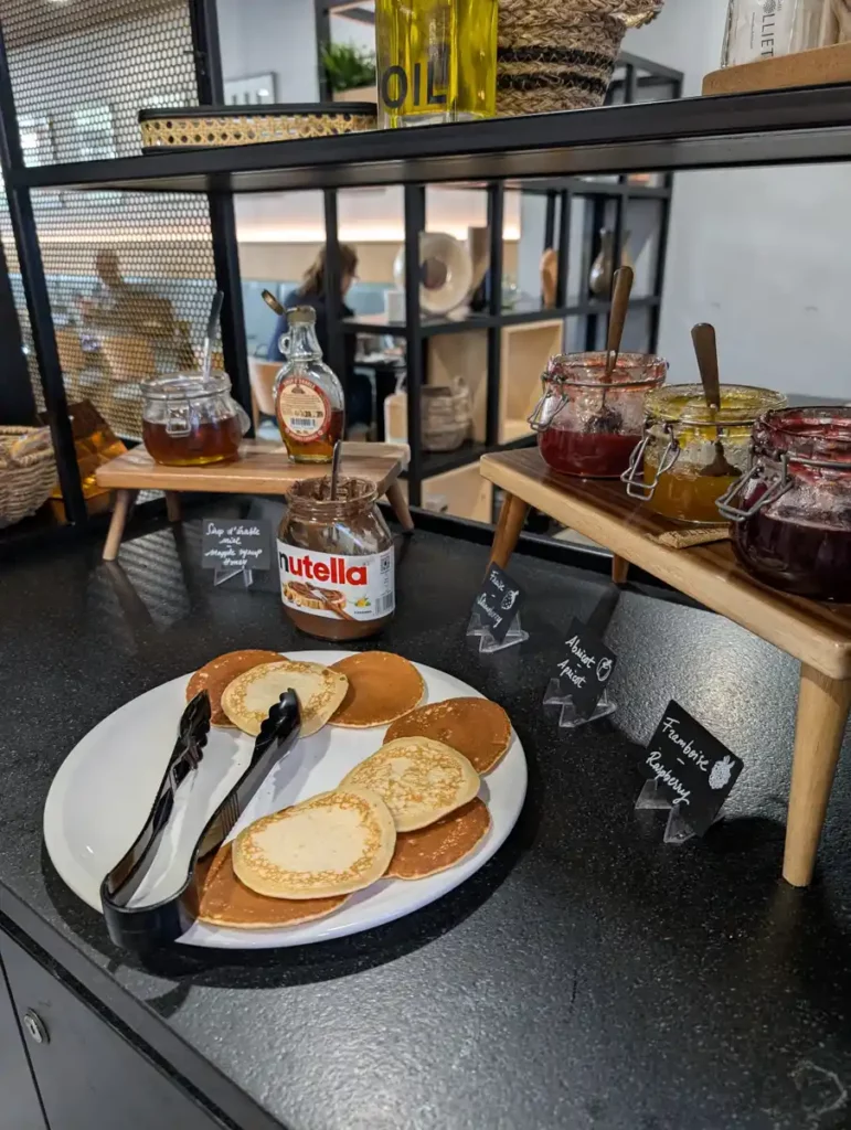 Pancakes, Nutella and jam at a hotel breakfast