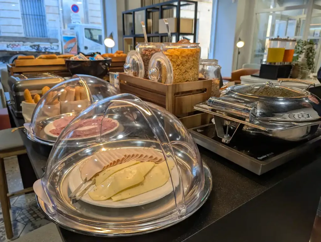 Cheese, sliced meat and cereal on a breakfast buffet