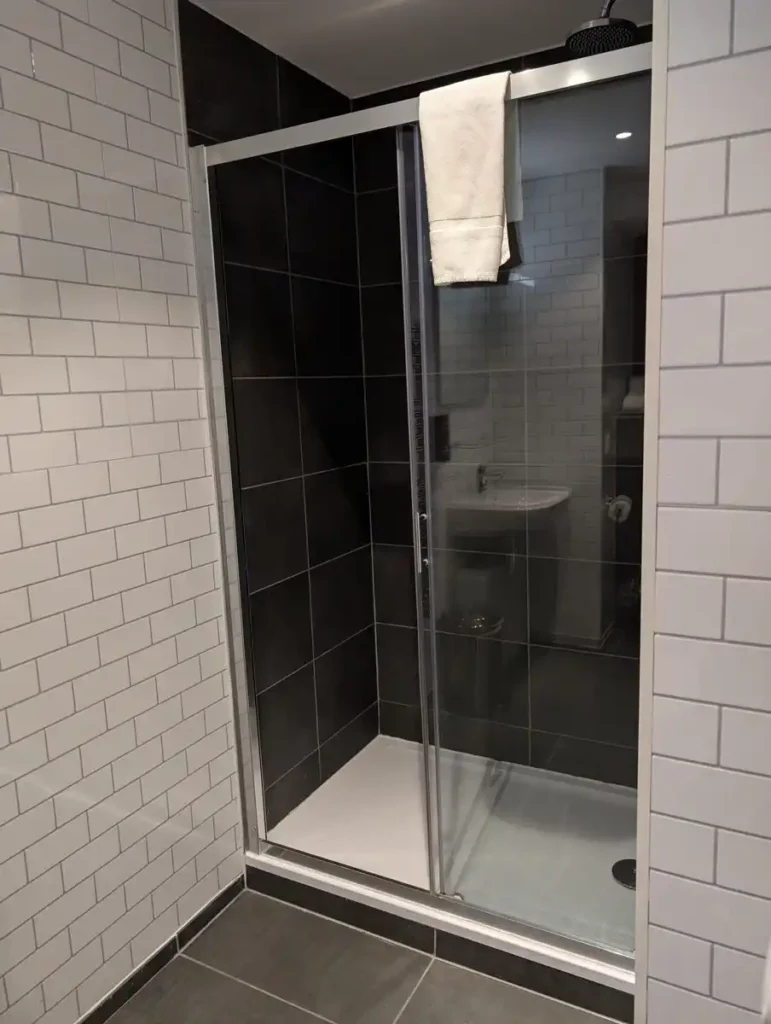 A shower in a hotel bathroom