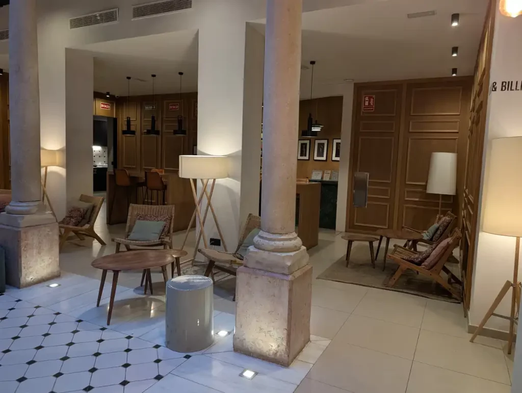 A common area with soft lighting and lots of seats