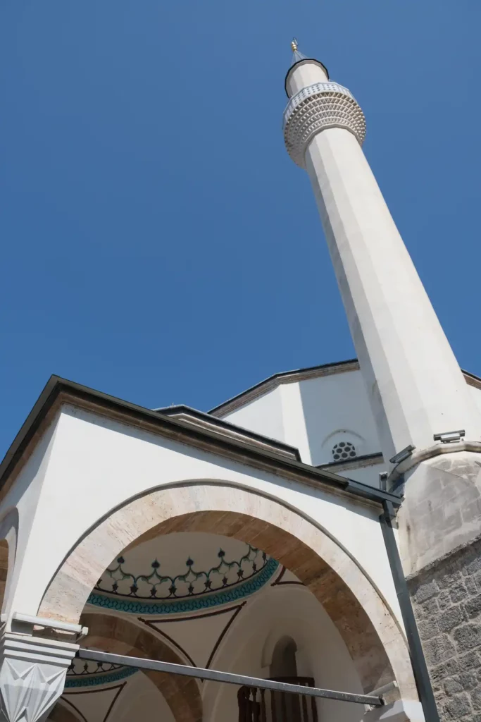 A large white mosque with minaret