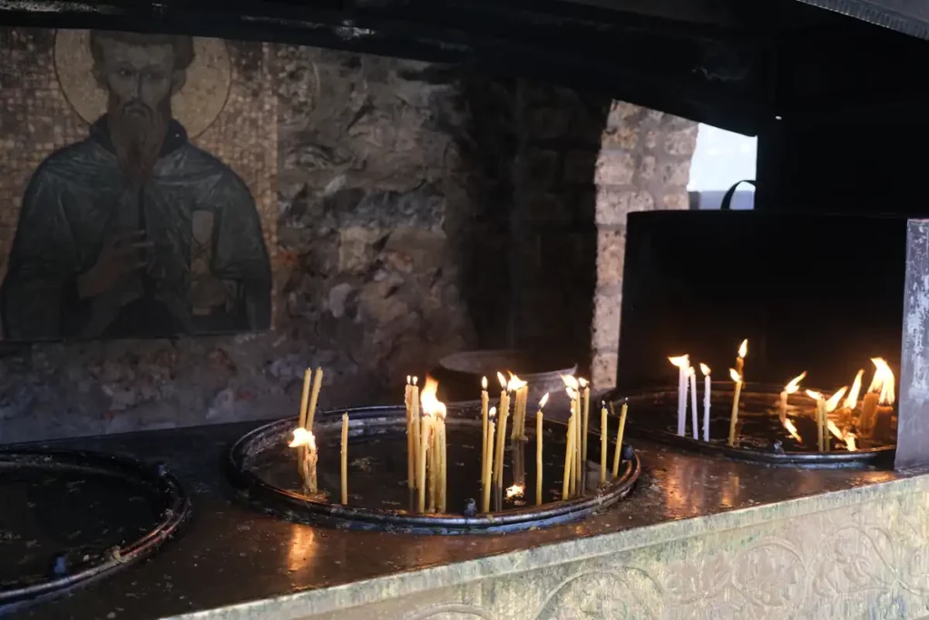 Slender prayer candles at St Naum church