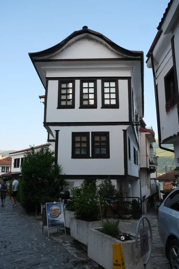 The house the Ohrid street lamps were modelled on. It's a thin black and white house, with three storeys getting bigger as they go up, and a curved roof.