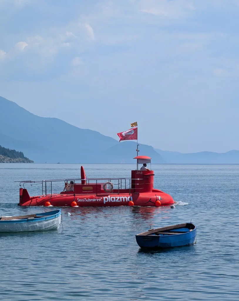 A red semi-submarine on a lake