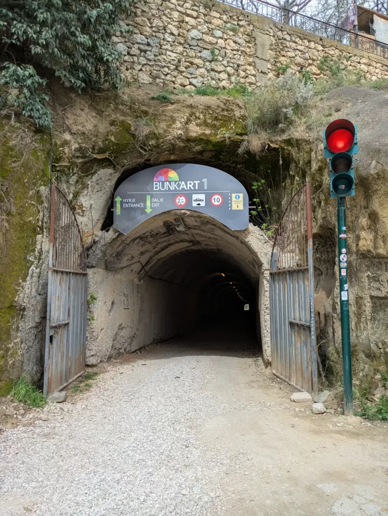 A long tunnel leading from the public road towards Bunk'Art 1