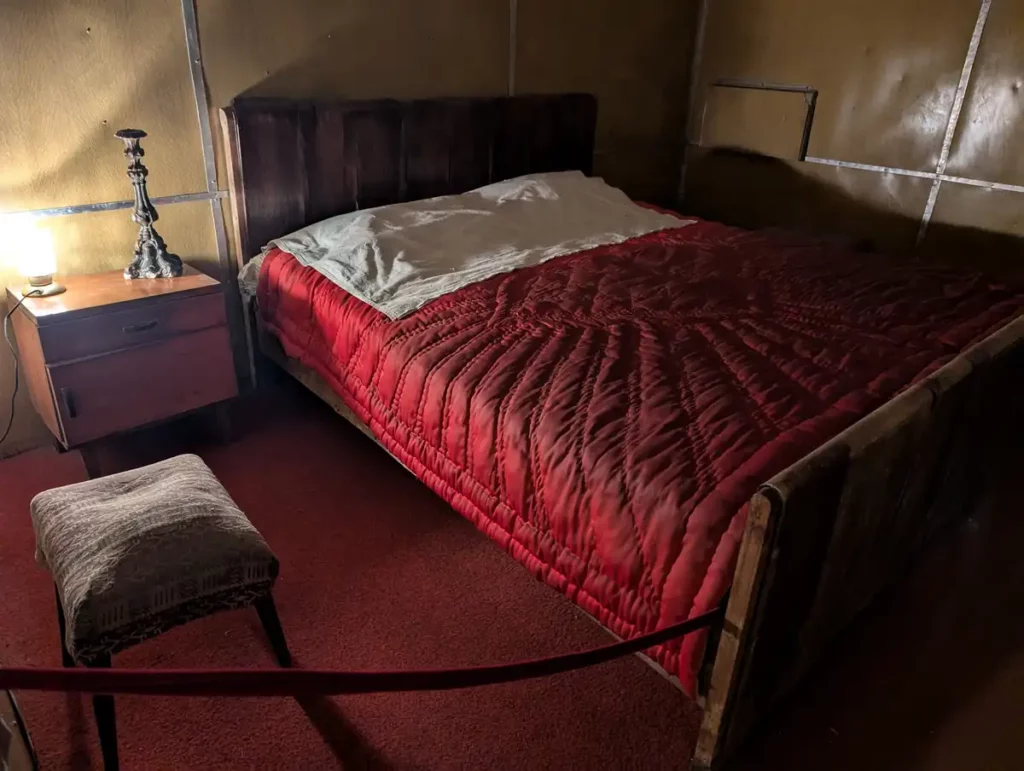 A bed in a dark underground room