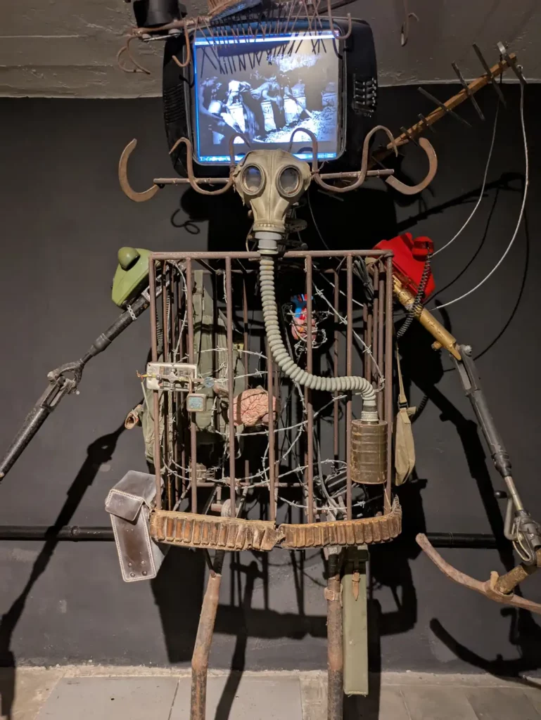 An art installation at Bunk'Art 2. A robot figure has a TV for a head.
