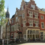 A canal street in Delft, one of the best day trips from Amsterdam