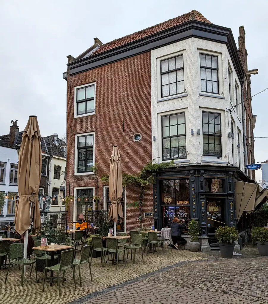 A cafe with outside tables on a canal bridge