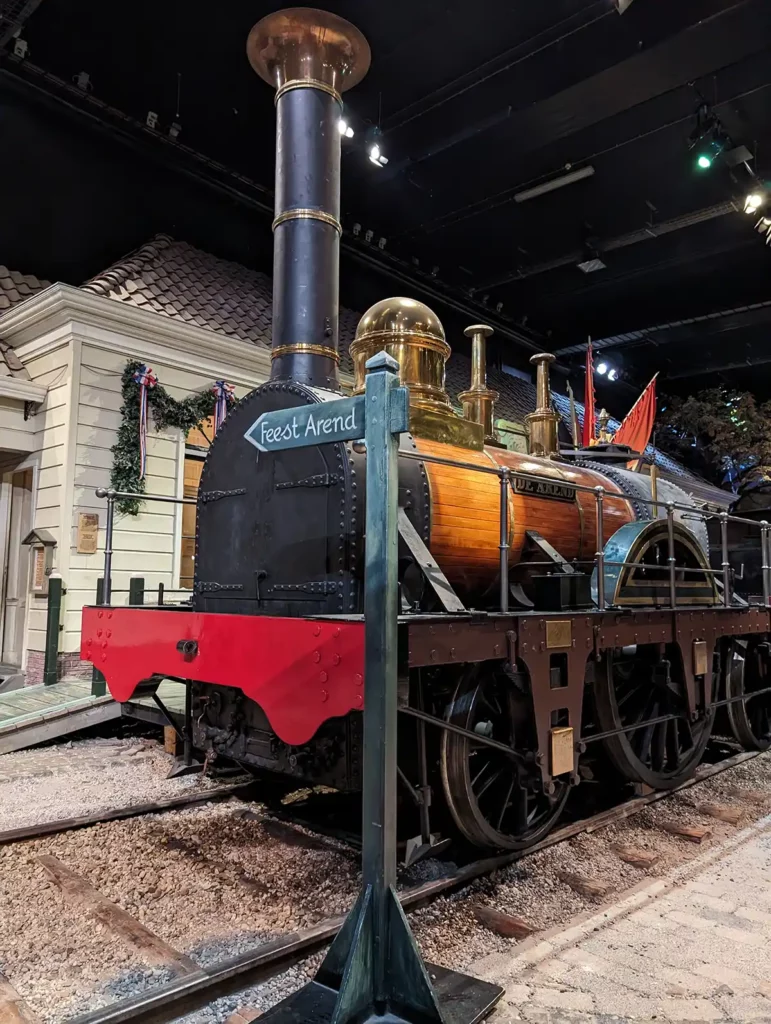 An exhibit celebrating the Netherlands' first railway station, with an early steam locomotive