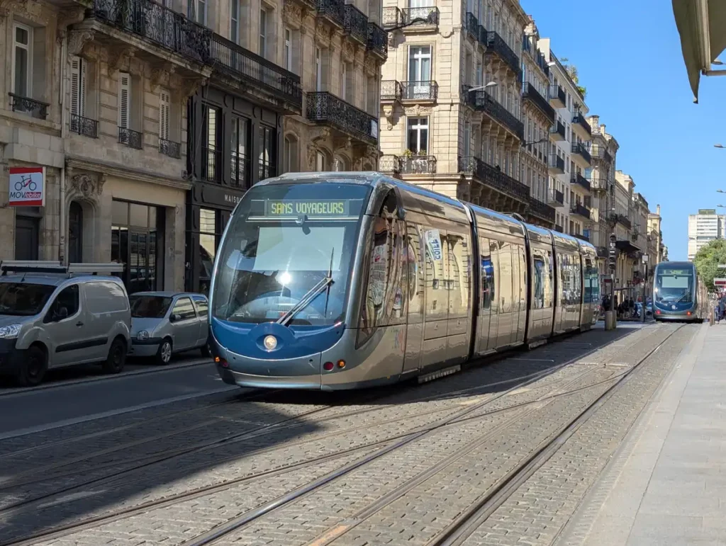 A modern tram on a city street in Bordeaux