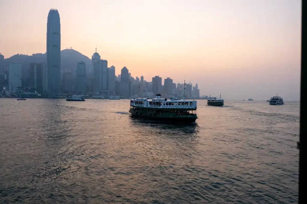 One of the Star Ferry boats crossing from Hong Kong Island to Kowloon at sunset