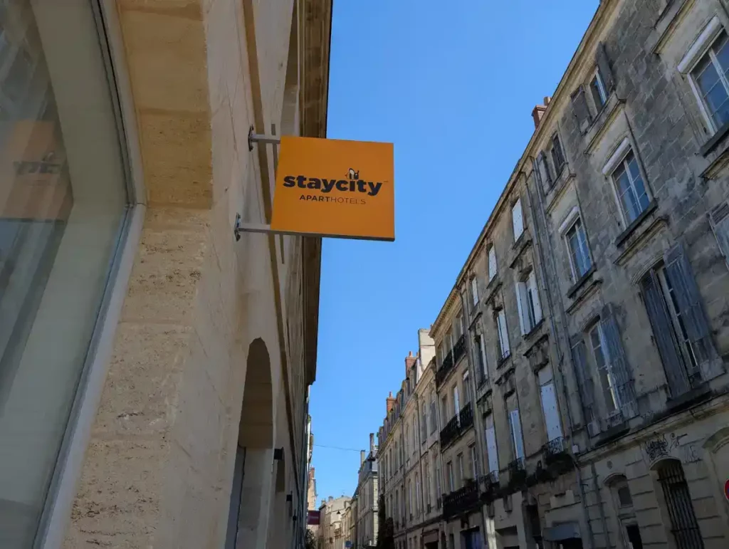 A Staycity hotel sign on a building in Bordeaux
