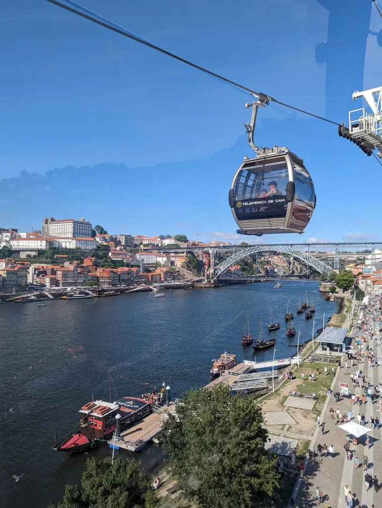 Riding the Teleférico de Gaia alongside the Douro river. There are awesome views over Porto's historic centre.
