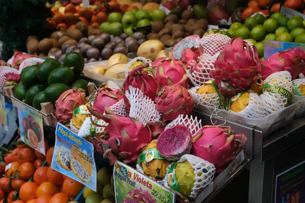 Brightly coloured exotic fruits at Mercado do Bolhão, one of the top places to visit in Porto