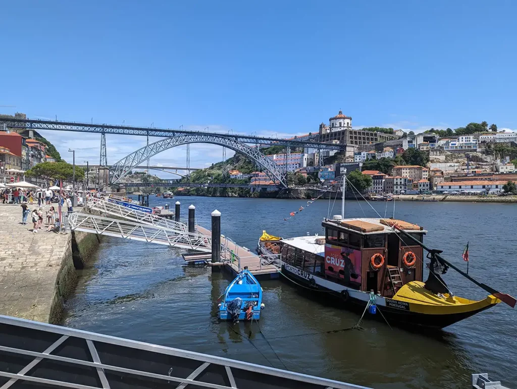 The Ribeira district of Porto, with a view of the Dom Luís bridge and a traditional boat moored