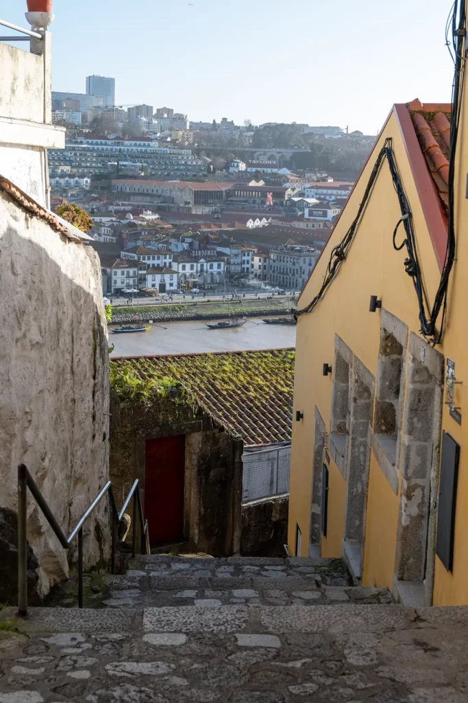 A steep staircase leading down to a wide river