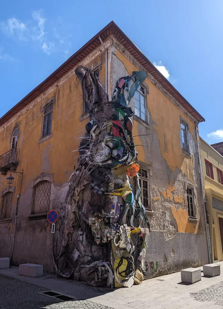 A giant rabbit made out of consumer waste on the corner of a building in Vila Nova de Gaia, across the river from Porto. Seeing the street art is one of the best things to do in Porto.