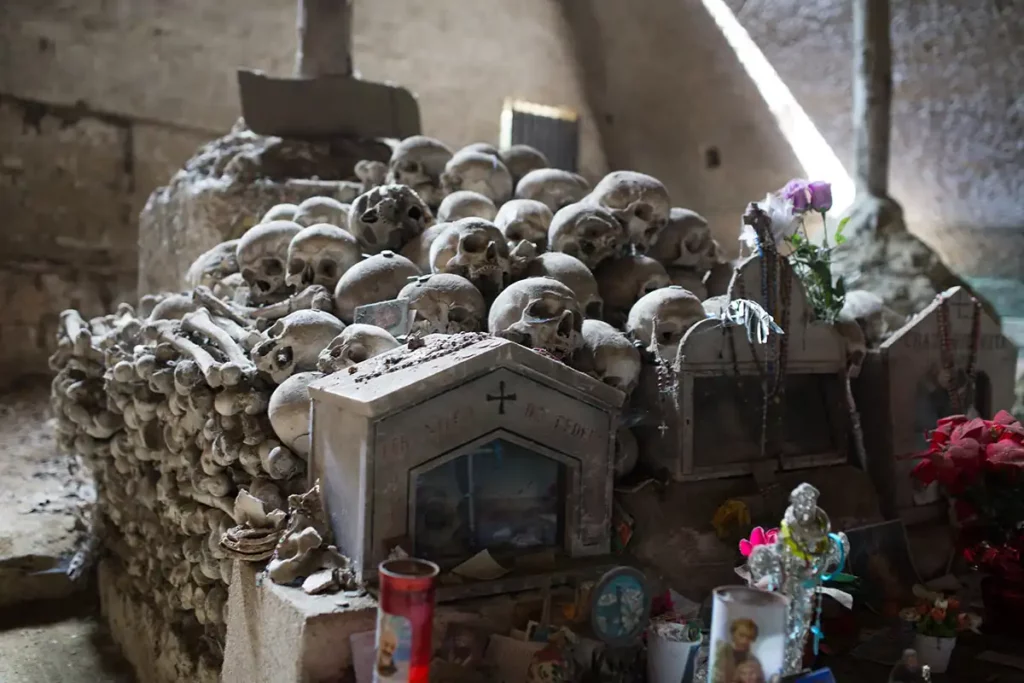 A pile of human skulls, lovingly decorated
